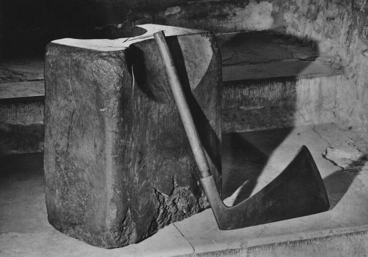 Axe resting on a large stone slab